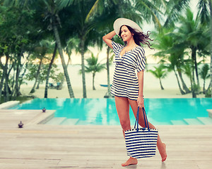 Image showing happy young woman in summer clothes and sun hat