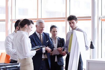 Image showing young startup businessman making presentation to senior investio