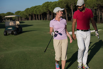 Image showing couple walking on golf course