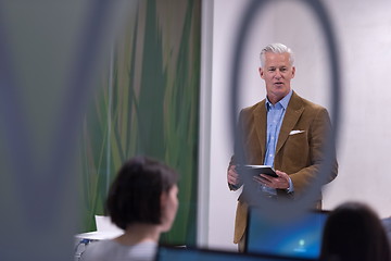 Image showing teacher and students in computer lab classroom