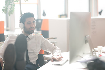 Image showing relaxed young business man at office