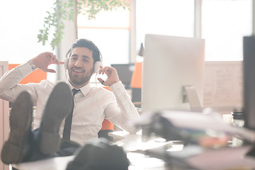 Image showing relaxed young business man at office