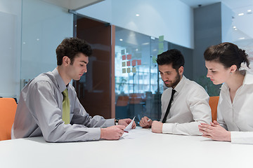 Image showing young couple signing contract documents on partners back