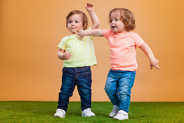 Image showing Happy funny girl twins sisters playing and laughing