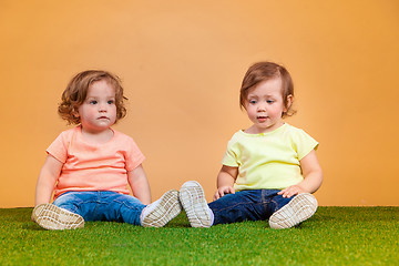 Image showing Happy funny girl twins sisters playing and laughing