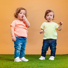 Image showing Happy funny girl twins sisters playing and laughing