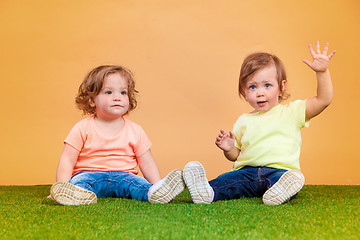 Image showing Happy funny girl twins sisters playing and laughing