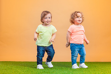 Image showing Happy funny girl twins sisters playing and laughing