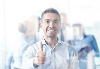 Image showing group of smiling businesspeople meeting in office