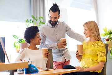 Image showing business team with coffee cups talking at office