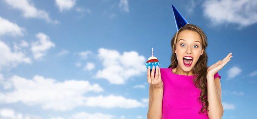 Image showing happy woman or teen girl with birthday cupcake