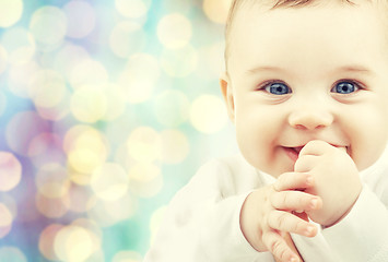 Image showing happy baby over blue holidays lights background