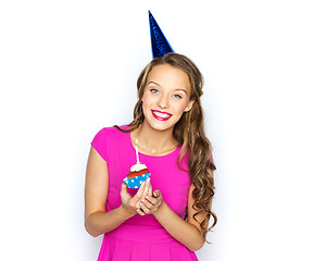 Image showing happy woman or teen girl with birthday cupcake