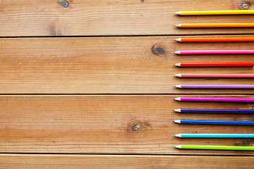 Image showing close up of crayons or color pencils on wood