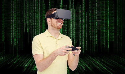 Image showing happy man in virtual reality headset with gamepad