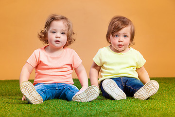 Image showing Happy funny girl twins sisters playing and laughing