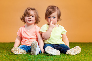 Image showing Happy funny girl twins sisters playing and laughing