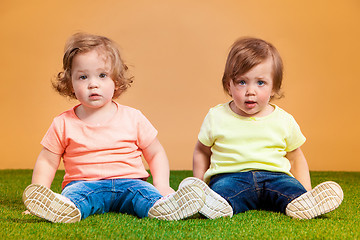 Image showing Happy funny girl twins sisters playing and laughing