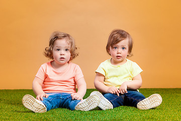 Image showing Happy funny girl twins sisters playing and laughing