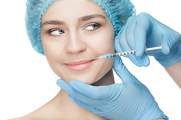 Image showing Attractive woman at plastic surgery with syringe in her face