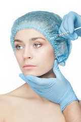 Image showing Attractive woman at plastic surgery with syringe in her face