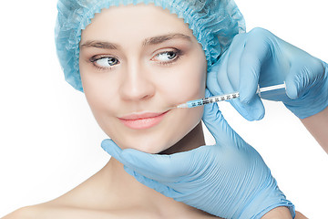 Image showing Attractive woman at plastic surgery with syringe in her face