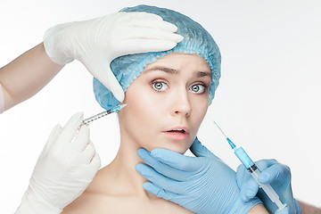 Image showing Attractive woman at plastic surgery with syringe in her face