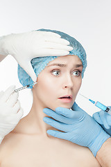 Image showing Attractive woman at plastic surgery with syringe in her face