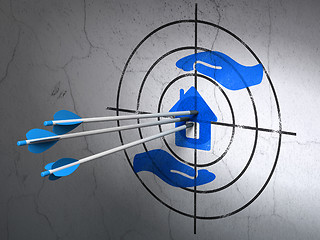 Image showing Insurance concept: arrows in House And Palm target on wall background