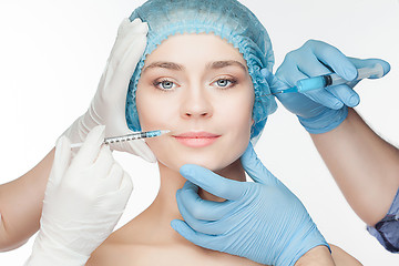 Image showing Attractive woman at plastic surgery with syringe in her face