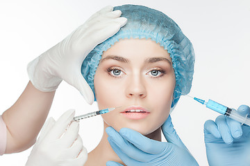 Image showing Attractive woman at plastic surgery with syringe in her face