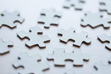 Image showing close up of puzzle pieces on table
