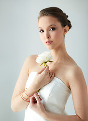 Image showing beautiful asian woman with flower and jewelry