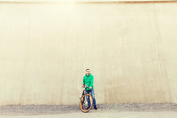 Image showing happy young hipster man with fixed gear bike