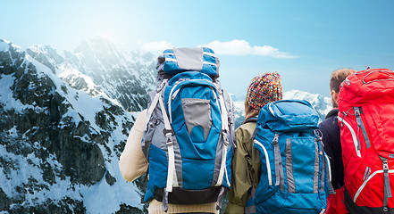 Image showing travelers with backpacks hiking in mountains