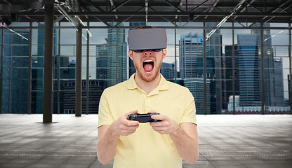 Image showing angry man in virtual reality headset with gamepad