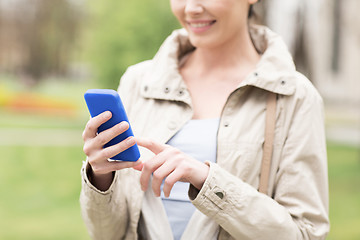 Image showing close up of woman calling on smartphone in park