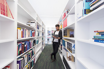 Image showing student with tablet in library