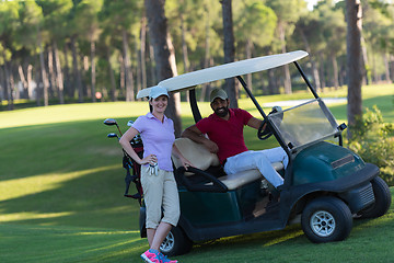 Image showing couple in buggy on golf course