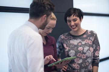 Image showing young business people group working on tablet