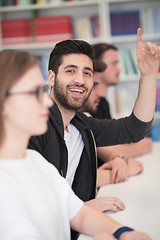 Image showing group of students  raise hands up