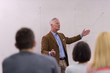 Image showing teacher with a group of students in classroom