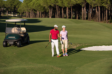 Image showing couple walking on golf course