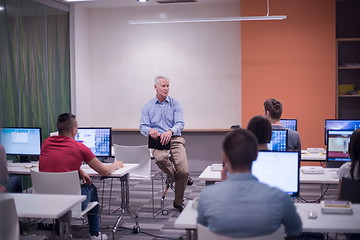 Image showing teacher and students in computer lab classroom