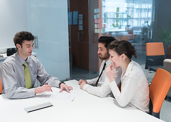 Image showing young couple signing contract documents on partners back