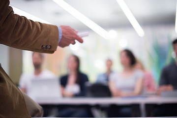 Image showing close up of teacher hand while teaching in classroom