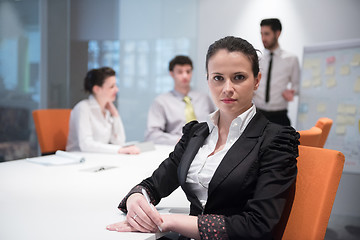 Image showing young business woman on meeting  using laptop computer