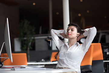 Image showing happy young business woman relaxing and geting insiration