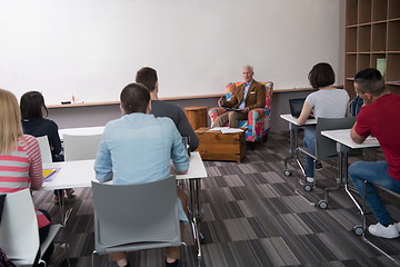 Image showing teacher with a group of students in classroom