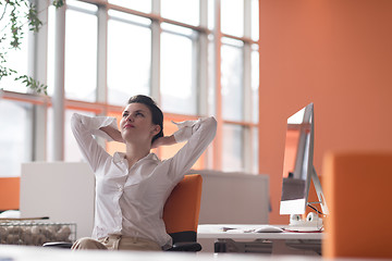 Image showing happy young business woman relaxing and geting insiration